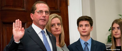 Health and Human Services Secretary Alex Azar, left, accompanied by his family, is sworn in during a ceremony in the Roosevelt Room at the White House, Monday, Jan. 29, 2018, in Washington. (AP Photo/Andrew Harnik)