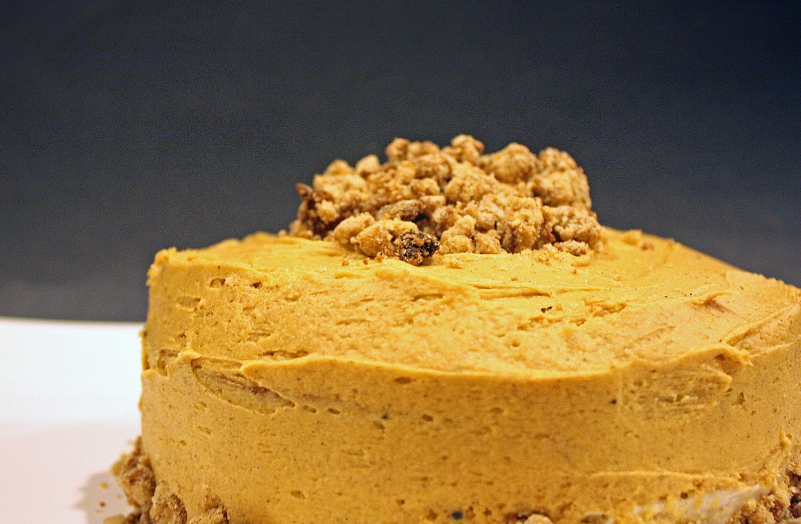 vegan maple gingerbread layer cake with cheesecake filling and spiced crumbs