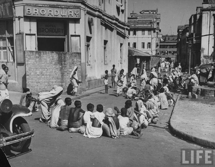 Starving Hindus waiting for the government controlled Grain Shop to open