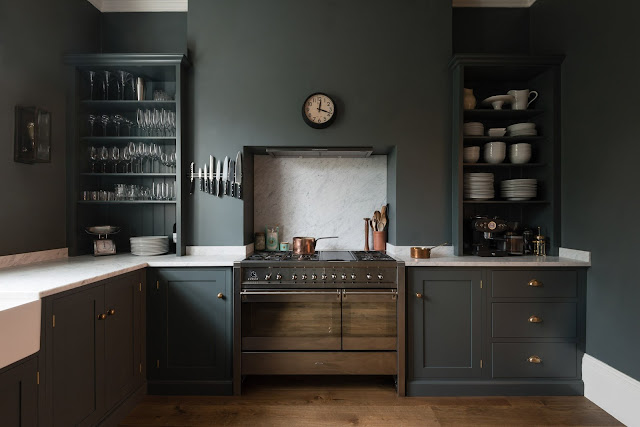 Dark blue-grey cabinets and walls in a luxurious classic London kitchen - found on Hello Lovely Studio