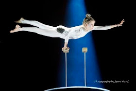 Zip Zap gymnast balancing on pole