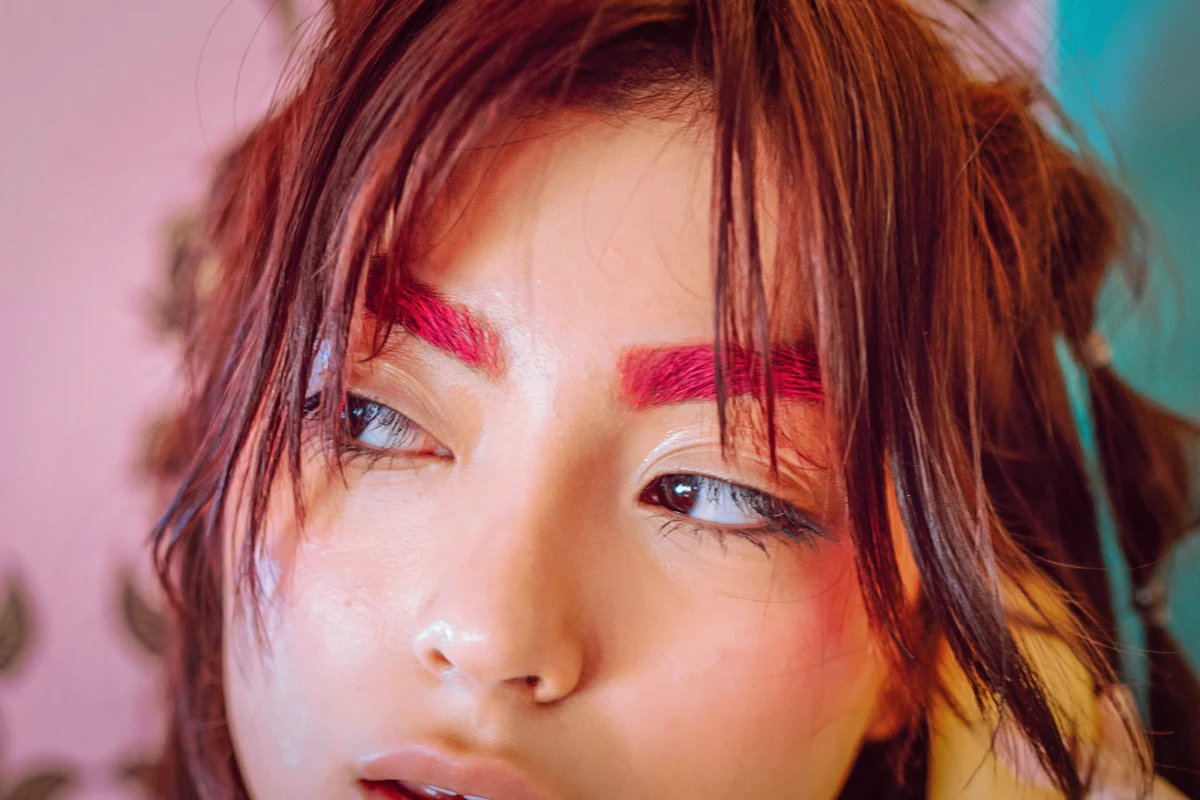 portrait of a beautiful woman with wispy bangs and styled hair