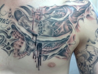 Biomechanical Heart Tattoo Design on Guys Chest