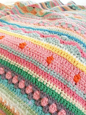 Crochet blanket with bright colors.