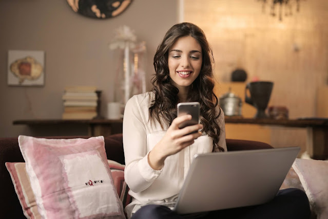 A brunette girl using her smartphone.