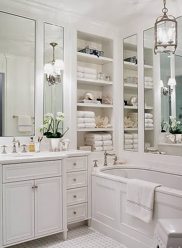 gorgeous white master bathroom paneled tub built in shelves
