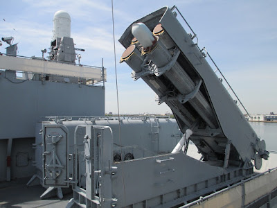 Two armored box launchers for the Tomahawk cruise missile aboard an Iowa-class battleship, one is open in the firing position