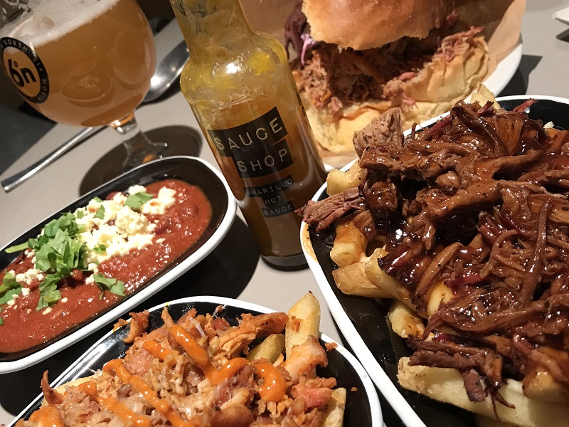 Brisket topped poutine, veggie chilli and pulled pork sandwich from Smoke and Soul