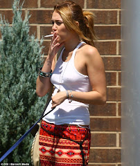 Smoking Hot Miley Cyrus Lights Up The Lake (and A Cigarette) In A Revealing Bikini Which Shows Off Her Slender Figure  6