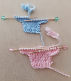 blue and pink tiny knitted sweaters