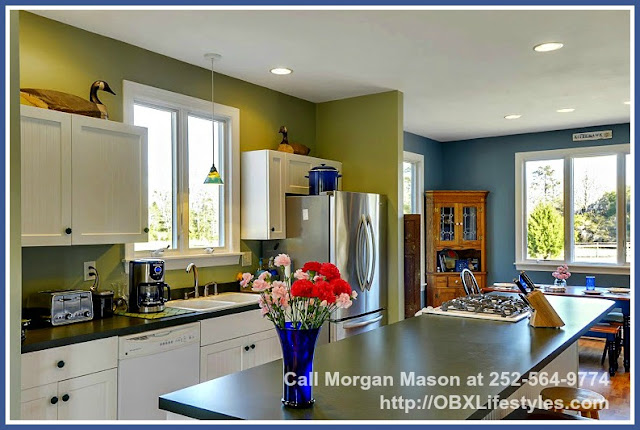The kitchen of this 4 bedroom equestrian property for sale on the Outer Banks NC comes complete with some new stainless steel appliances. 