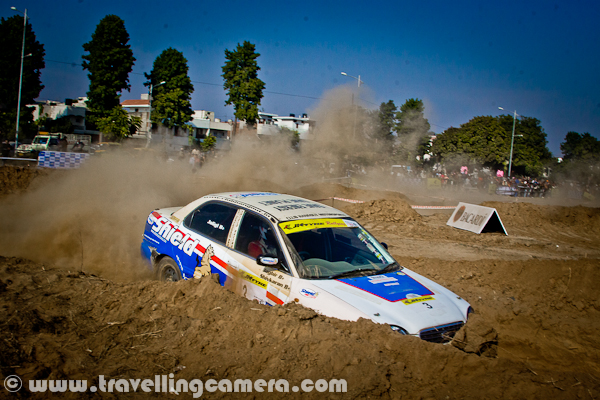 Last week, a motorsport event took place in Mohali (Near Chandigarh), which was organized by OYA Auto Cross and Motorcross. JK Tyre was one of the main sponsor of this event and it continued for three days. During final day I also visited the ground to bring this PHOTO JOURNEY for you. Let's check it out...Cars were literally flying on this ground and whole region was full of dust only. At times it was difficult to see these moving cars. It was hard to imagine that we were standing on a ground which is not in states like Rajasthan. The only word was coming to my mind at that point of time - Dust-Storm, like the one happens in Rajasthan; 'Desert Storm'... Let's check out more photographs from this series of Dust-Storm in Chandigarh...Different types of Cars and Bikes participated in this event, but cars competitions were mainly compelling us to rename it as 'Dust Storm'. Only two cars at a time were enough to cover sky with dust.I am not sure what this 'Dewars' was, but various pillars were planted on this ground. These should be some brands who supported this motorsport event. Barista was also there to serve snacks and drinks, but not sure if they were sponsors or not.Different cars by Honda, Maruti, Mitsubishi & Toyota participated in this event. At times, it was hard to believe that some specific cars can fly like this... One of the rider was very well controlling a white Swift, and it was competing with a 4 by 4 Jypsy...These cars were making the ground-dust to fly in air and at times, they used to cover themselves by dust storms. Specifically, there was huge dust on taking any turn.A colorful Maruti Car going down into a tunnel which was created artificially on this ground for Motorcross competitions during 3rd OYA sports-event.Passion of all these riders was commendable and it was hard to imagine that human beings were driving these super-machines.'Dust Storm' is something coined on run-time and not related to this event.I tried to check about this event on FMSCI website but couldn't find any details. Website of OYA was not much helpful for me to get information as non-motorsport person. Anyway, please have a loo at following link to know more about the organization which organized this event in Mohali - http://oyamohali.comWhole ground was surrounded by lot of people who wanted to see these races, but unfortunately the dust was biggest enemy. After one lap of car racing, there was nothing visible on ground. So everyone was more excited about bike racing, which had more participants at one point of time and things were visible as least.Motrosports in India is one of the increasing passion among people in cities like chadigarh. Now India is also getting some powerful machines, which was not that easy few years back. But still lot of folks can't afford these powerful machines without sponsorship and in such competitions, it's not easy thing to compete with imported machines with our usual bikes.Another shot where another car is contributing to Dust Storm on this ground in Mohali, Punjab, INDIA...After lot of dust in above photographs, I also thought of sharing some bike photographs to show another side of the PHOTO JOURNEY...It seems that bikers in such competitions also use their legs as supporting equipment while turning these machines on extremely high speed.With this, let me finish this Photo Journey of Dust Storm in Chandigarh (Mohali, Punjab)