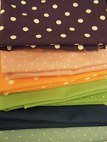 A stack of polka dotted fabric