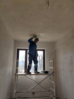 Sally up the scaffold painting the ceiling