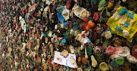 Alley wall covered with various color wads of bubble gum