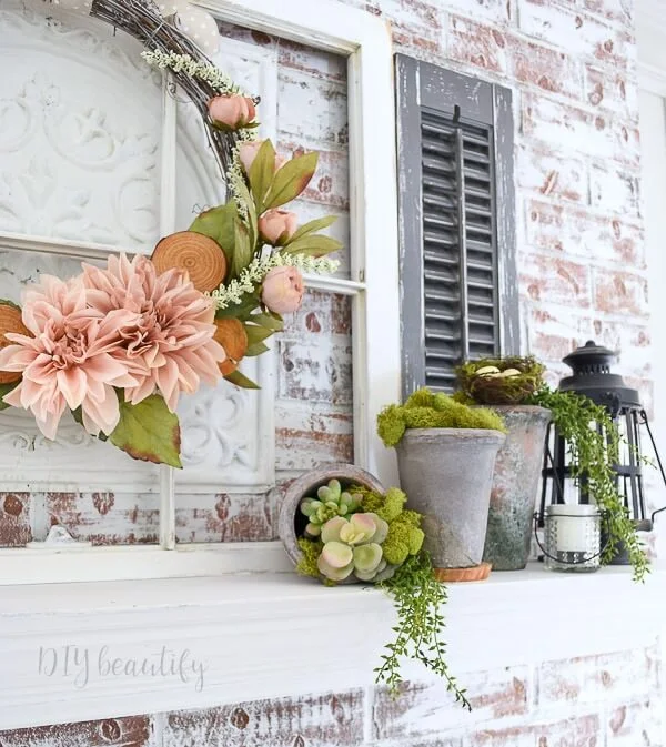 layered mantle with wreath and succulents