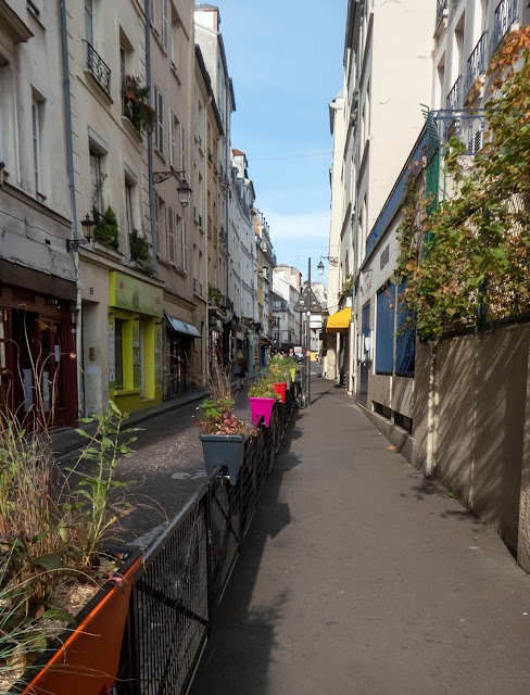 Colourful flower boxes on Rue Mouffetard in Paris