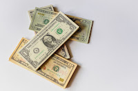 Dollar bill - Photo by Alexander Schimmeck on Unsplash