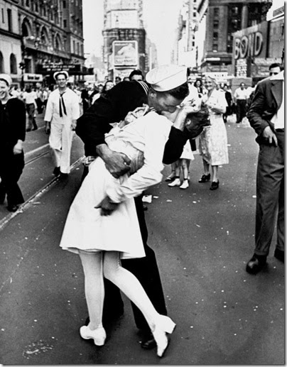 A jubilant American sailor clutching a white-uniformed nurse in a back-bending, passionate kiss as he vents his joy while thousands jam Times Square to celebrate the long awaited-victory over Japan.  (Photo by Alfred Eisenstaedt//Time Life Pictures/Getty Images)