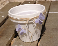 white vase with lilac butterflies