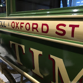 Hand-painted lettering on an old omnibus at the London Transport Museum