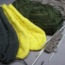 knitted slippers in yellow and dark grey or gray