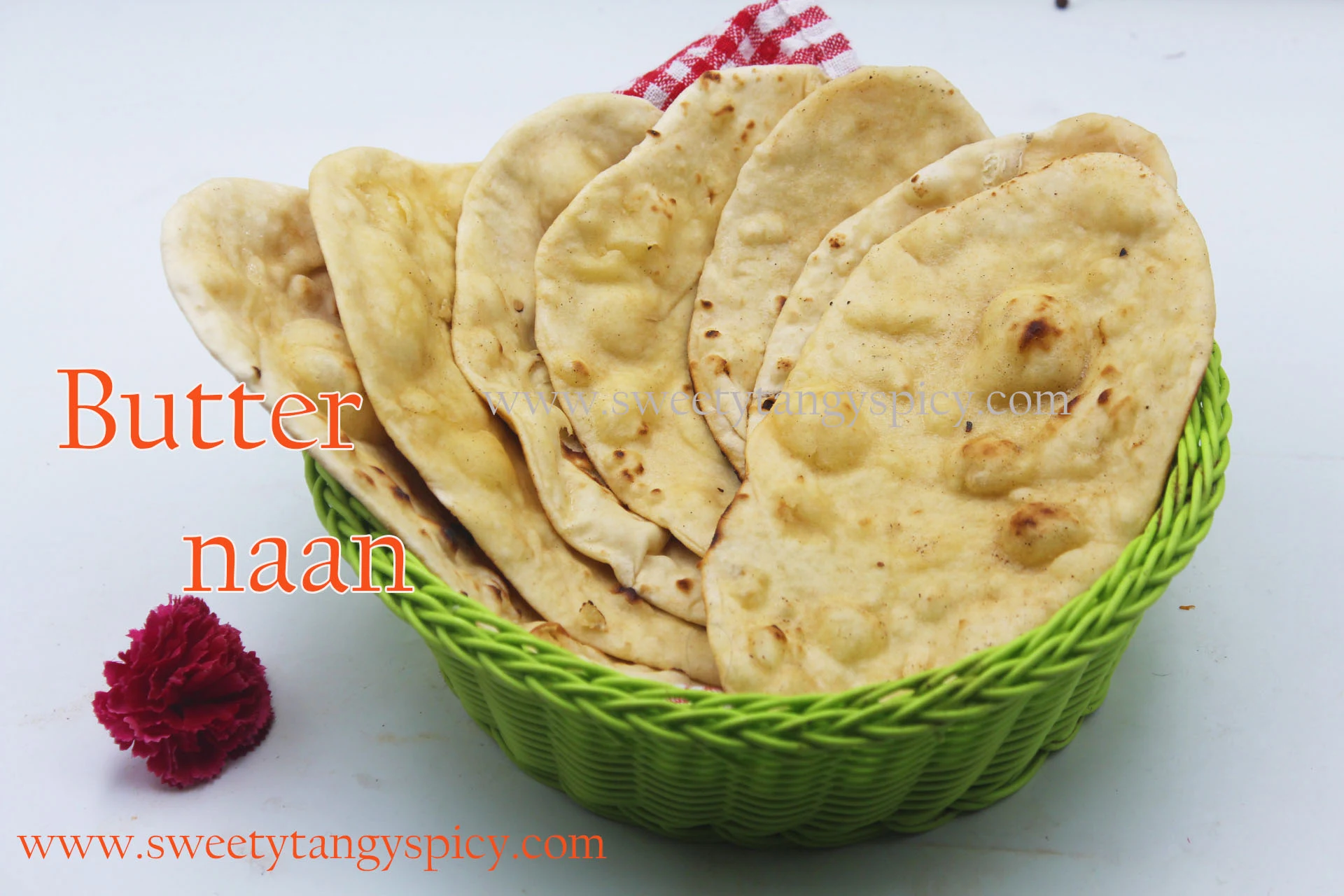 Butter Naan presented in a Green-Colored Plastic Basket