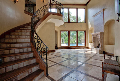 gorgeous stairs and open foyer with natural sunlights