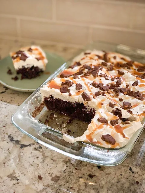 Irresistible Symphony Cake, devil's food chocolate cake mix, infused with sweetened condensed milk, topped with whipped topping, drizzled with caramel ice cream topping, and sprinkled with chopped chocolate symphony candy bars.  Delectable.