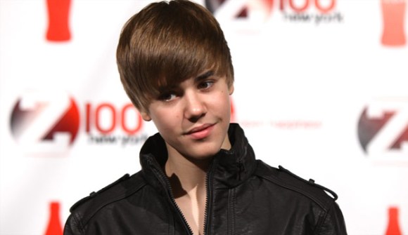 justin bieber in purple 2011. justin bieber hairstyle 2011.