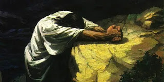 Jesús inclinado orando