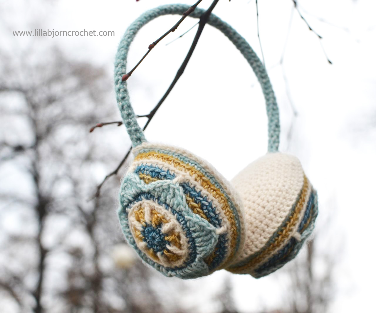 Crocheted ear muffs with flower. Designed by Lilla Bjorn Crochet - overlay crochet