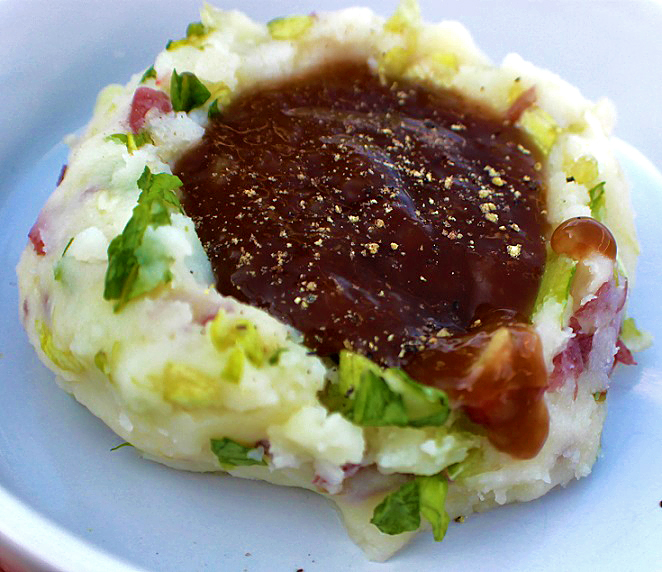 this is a dish of colcannon potatoes with Irish Guinness beer gravy puddled in the middle