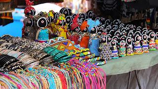 Image of craft vendor African bead and figurine selection