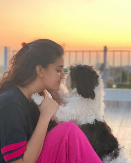 Keerthy Suresh in Black and Pink Dress with Cute Smile with her Cute Dog at her Home