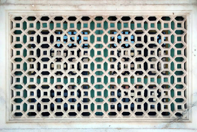 Intricately carved marble jali window