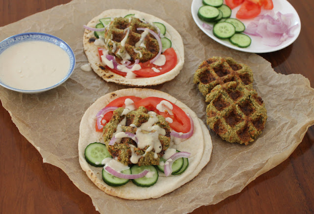 Food Lust People Love: Waffled falafel sandwiches are made by cooking your homemade falafel mix in a lightly oiled waffle iron which gets the falafels crispy outside and fluffy inside without frying. Stuff them in flatbread, drizzled with tahini sauce.