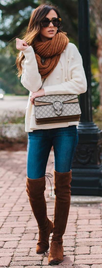 cozy winter outfit idea : knit scarf + white sweater + skinny jeans + brown over knee boots + bag