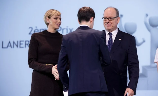 Vice-President of the Monaco Red Cross Princess Charlene wore a black knit wool midi dress by Akris