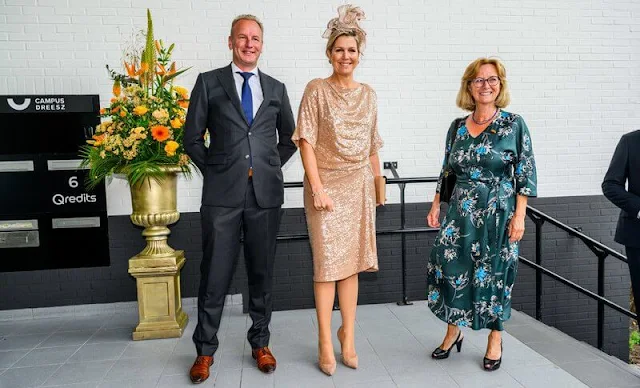 Queen Maxima wore a sequin skirt and blouse by Natan, and a hat by Fabienne Delvigne. Gianvito Rossi pumps