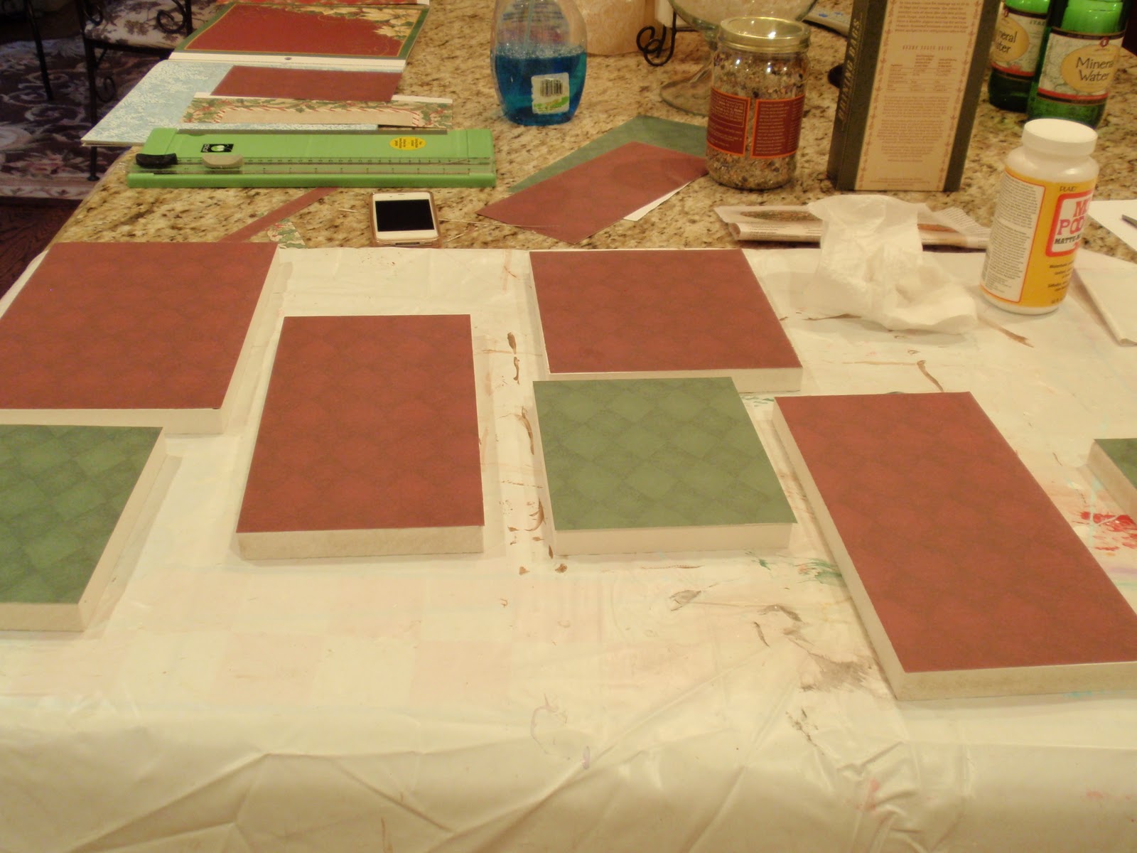 ... and decoupaged Christmas scrapbook paper onto the fronts of the board