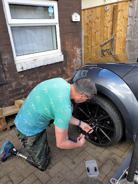 Glenn removing wheel bolts