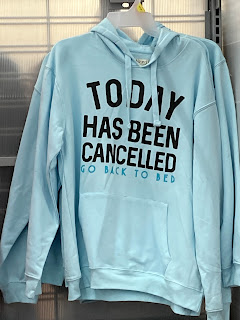 sweatshirt with the slogan "Today has been cancelled. Go back to bed."