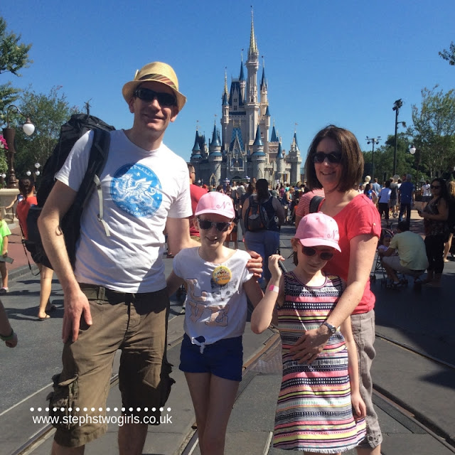 Stephs two girls family in front of magic kingdom castle