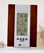 Wireless Forecast Station - wake up alarm, barometric pressure and its trend, temperature reading. Have a Mostly Sunny Day!