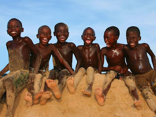 Beautiful Photography Picture of Angola Boys at a remote beach, south of Luanda