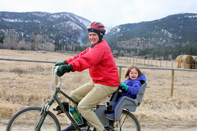 Amy and Anna riding a bike