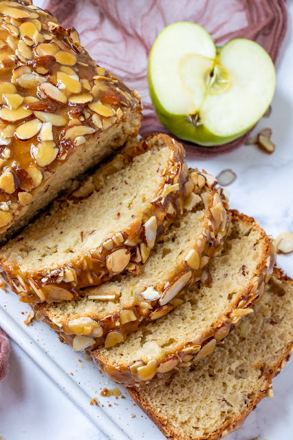 This delicious fall bread is packed with chunks of apples and topped with a delicious, buttery caramel almond mixture! Try it for breakfast, snack or dessert and enjoy every last bite!