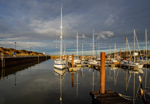 Photo of sun breaking through the clouds at Maryport Marina on Monday