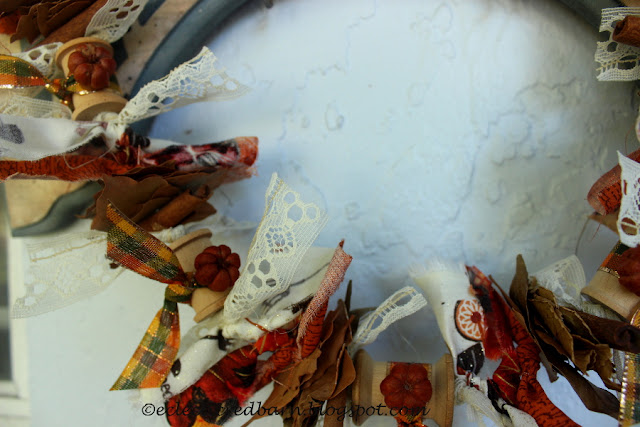 Eclectic Red Barn:Ribbon and Tiny pumpkins added to wooden spools of thread